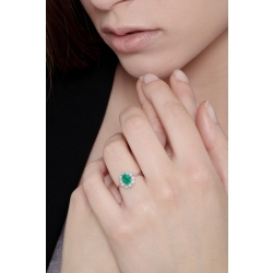 ANELLO CONTORNO CON 10BRILLANTI E SMERALDO OVALE MM7X5 CIRCA 2
