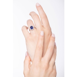 White gold 18k halo ring with a central blue sapphire and diamonds  2
