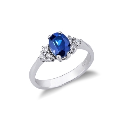 White gold 18k ring with lateral diamonds and blue sapphire 