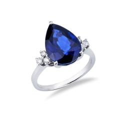 Ring in white gold 18k with central blue sapphire drop cut and three diamonds per side
