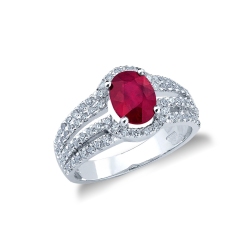 Bague en or blanc 750 avec rubis ovale et halo de diamants