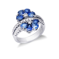 18k white gold flower shaped ring with blue sapphires and diamonds 