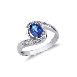 18k white gold ring with a central blue sapphire oval cut and diamonds 