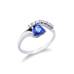 White gold ring with blue sapphire heart cut and a row of diamonds 