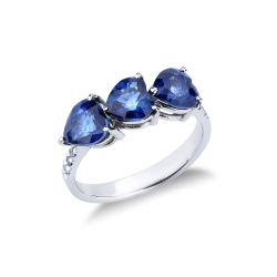 White gold ring with three sapphires heart cut and diamonds shoulder set