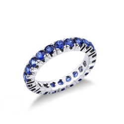 Eternity ring with blue sapphires in 18kt white gold