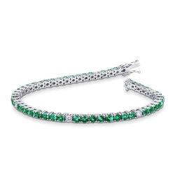 18k white gold tennis bracelet with emeralds and round cut diamonds