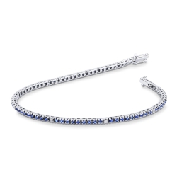 Bracelet tennis griffes en or blanc 18K avec saphirs bleus et diamants