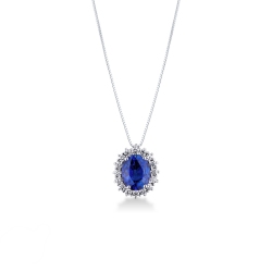 Pendentif en or blanc 18 ct avec saphir bleu taille ovale et halo diamants