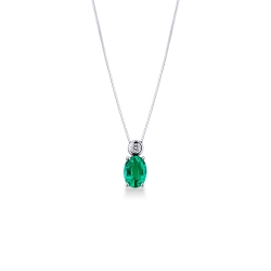 Solitaire emerald pendant with round cut diamond