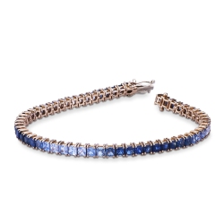 Fancy 18k rose gold tennis bracelet with blue sapphires