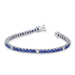 Bracelet tennis à griffes en or blanc 18 carats serti de saphirs bleus
