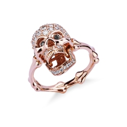 Rosé gold 18k skull ring with black and white diamonds 