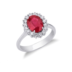 Bague en or blanc 18k avec rubis ovale et entourage de diamants
